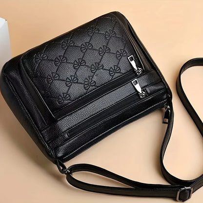 URBAN EDGE™ — BLACK CROSSBODY BAG WITH EMBOSSED GEOMETRIC PATTERN