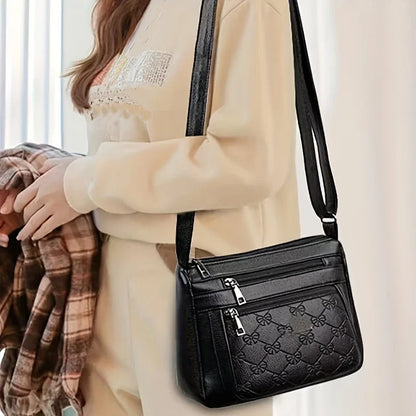 URBAN EDGE™ — BLACK CROSSBODY BAG WITH EMBOSSED GEOMETRIC PATTERN