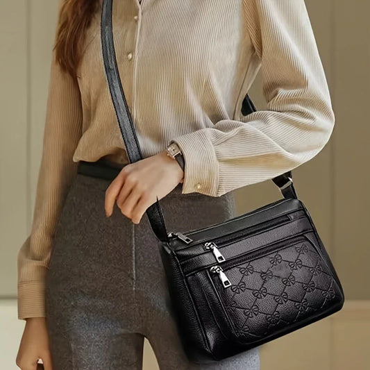 URBAN EDGE™ — BLACK CROSSBODY BAG WITH EMBOSSED GEOMETRIC PATTERN